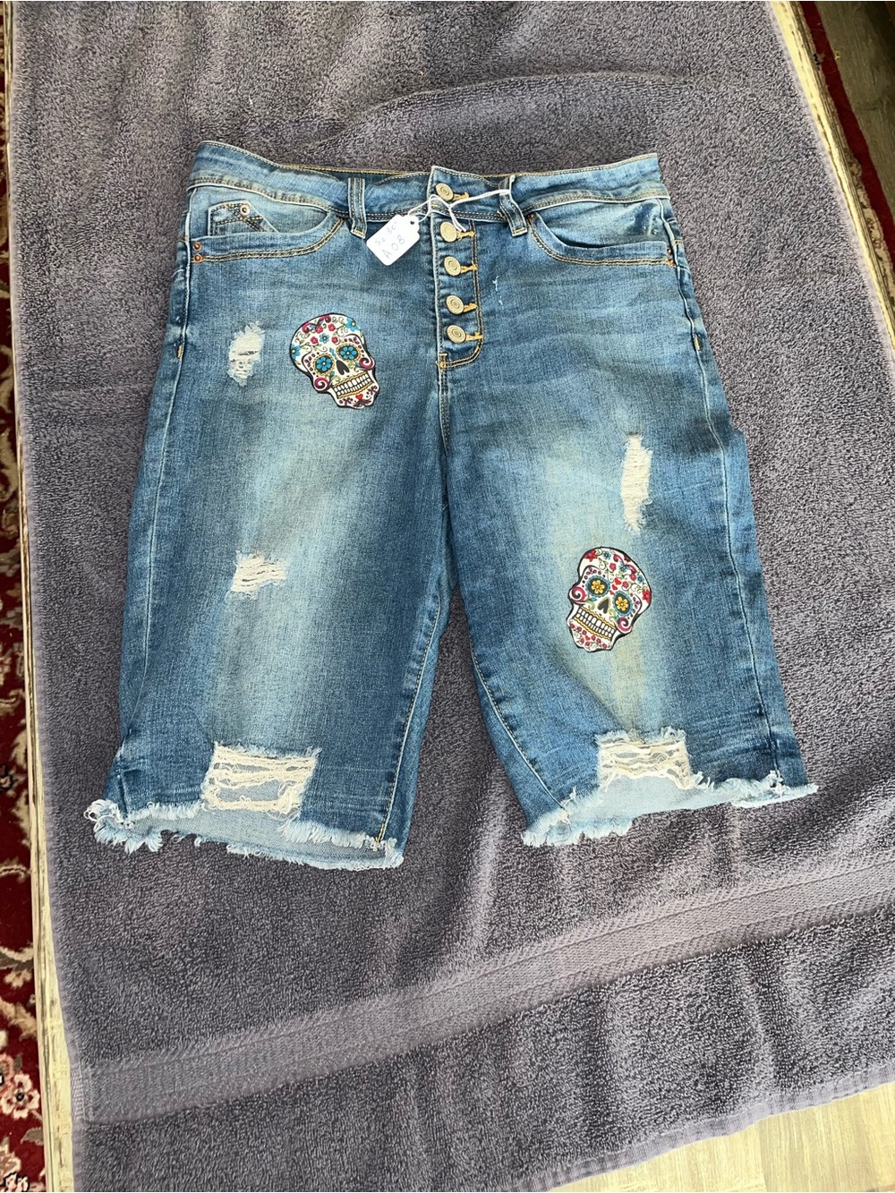 Women’s button fly Distressed Denim Bermuda Shorts with Sugar Skull Embroidery